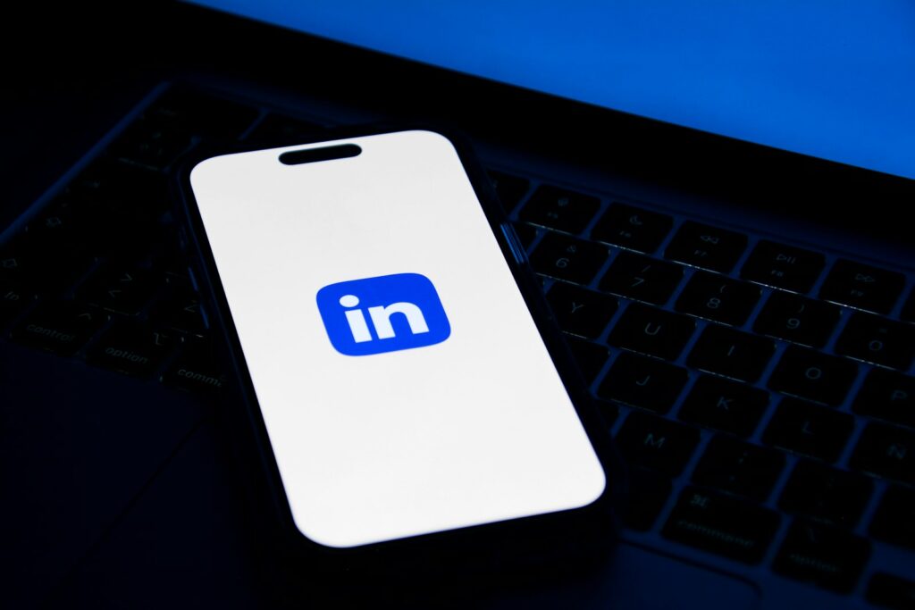 Professional working on a laptop to grow a personal brand on LinkedIn with AI tools
