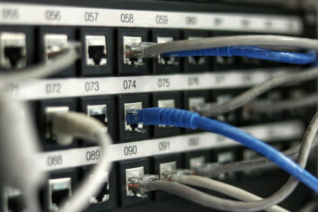 Network cables connected to a data switch, representing cloud storage sync